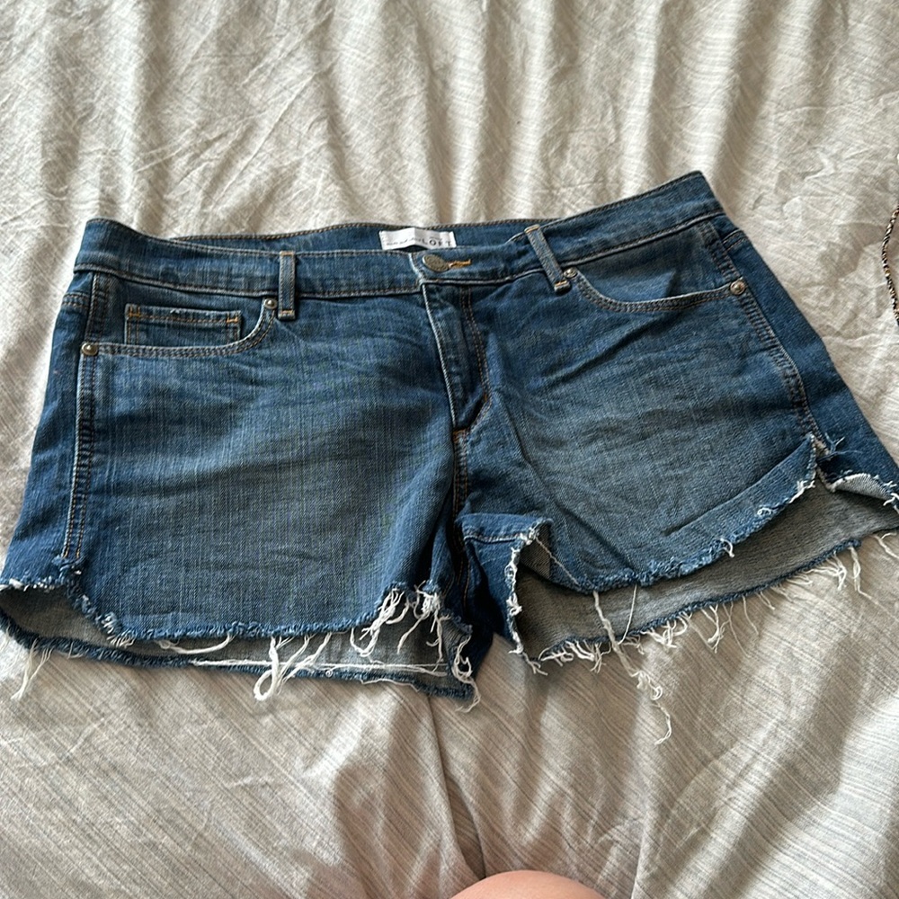 Medium wash distressed bottom denim jeans